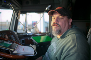Dan Dailey of Morrisonville has been a truck driver for 22 years, his current truck is the 3rd one he has owned.  At times 
he is gone 3 months at a time. 'I hate everyday of it' he said 'I am only doing this until something better come along.'