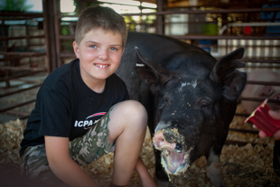 Reagon Carter, age 9, of Quincy and Tippy, his 301 lb. show hog. This is his first year to show in the Heart of Illinois Fair.