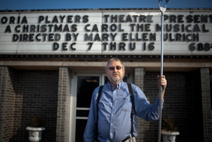 Jim Babrowski has been in more productions with the Peoria Players Theatre than anyone else... ever.
  He has been involved with them for 33 years. Now that he is retired, he volunteers 20-30
 hours a week at the Theatre. Today, he is putting up the new marquee.