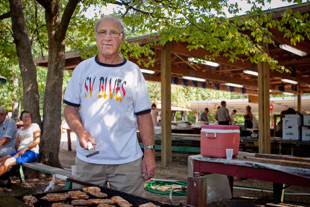 Joe Spies has been a member of the German American Central Society for 58 years. 
Today he is helping the organization by cooking pork chops for the Corn Boil fundraiser.