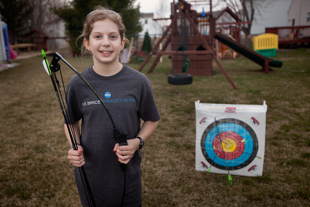 Brooke Wetherill is taking advantage of the warm weather to practice archery with her family. She likes being active, participating in: softball, volleyball, Girl Scouts and swimming. ‘I like softball the most’ she said.