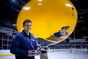 Terry Miller is an account executive for the Peoria Rivermen hockey team. This week he was given an additional responsibility,
 flying the RC Blimp at the games.  He is nervous about his debut at this Friday’s home game, so he is doing some practicing.