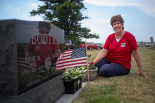 Lori Schertz of Metamora, is at St. Clement Cemetery in Dunlap IL. This Memorial Day she is at the grave of her father James E Bodtke Jr., who people say looked like Dean Martin.  He was a Catholic. He served in the Navy during WWII on the USS Maryland. 'He was very proud of his country'