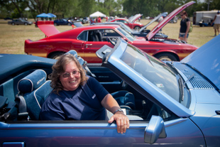 Altina Piasecki from Golden MO, is a Boeing engineer. She and her 1989 Ford ASC McLaren Limited edition convertible
 are at the Mustang Car show in Wichita KS.