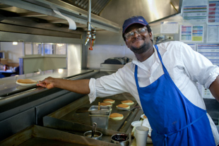 Moussa Doumbia, originally from the West African country of Mali, is a cook at IHOP, today is International Pancake Day. 
IHOP is giving away free pancakes and taking donations for the Children’s Miracle Network.
 Moussa thinks he will make more than 2,000 pancakes this morning.