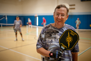 Fred Fry started playing Pickleball about 4 years ago. Recently, he and a few friends helped 
the Peoria Park District get a program started; now they are 85 players strong. 
He got me to give it a try (he is very persuasive) and he is right it is lots of fun.