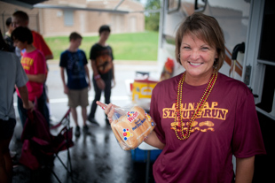 Lorrie Palladini Wu has been hosting a tailgate party for her 3 daughters and their friends at Dunlap’s homecoming game 
for the last 3 years. She is also a Realtor, but says being a mom and wife are her first jobs.