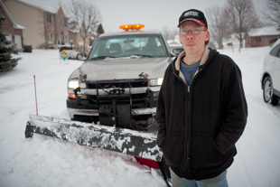 Kevin Shillinger has been up since 3:00 a.m. plowing snow for the City of Peoria.
 He works for a private contractor and likes the snow because it brings 
in money for his family. However, ‘I’m ready for spring’ he said.