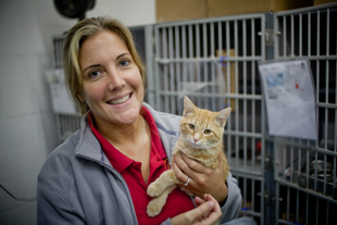 Jennifer Hennings is an Administrative Specialist at Peoria Animal Welfare Shelter (P.A.W.S.)
 She has worked there for 2 years and loves it, especially the animals.  She is holding a 5 month old tabby.