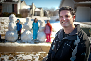 Dan Carey is spending some time playing in the snow with his and some neighborhood kids.
 ‘the first idea was to have a snowball fight, which turned into a better idea of building snow men’ he said.