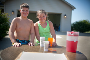 Will and Taylor Weaver, 9 year old twin entrepreneurs, are selling Kool-Aid to thirsty neighbors.  
When asked what they plan to do with the cash, 'save up and buy some books' was the answer.