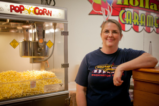 Cindy Custer’s first job popping popcorn was when she was a little girl and her grandparents had a machine 
and traveled to events. Now she is working at Holland’s Caramel Corn in Washington, IL 
where they will pop corn for 12 hours a day during the busy season.