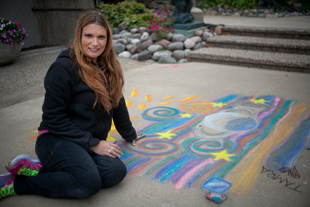 Tamra Antenucci is participating in ‘Chalk the Walk’ at Tower Park in Peoria Heights for the fun of it.  
Her full time job is a different kind of art, she performs with LED and Fire hoops at events and parties.