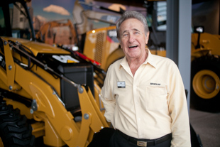 Ken Gerber is a host at the New Caterpillar Visitor Center.  He retired from Caterpillar 22 years ago where
 he started sweeping floors in the offices and 36 years later was a manager in the customer services department.  
 He said Caterpillar is a great company because there is a culture of dedication to quality.