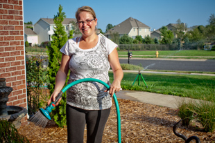 Melissa Fassino of Dunlap is watering her plants, trying to help them survive the heat. 
 ‘We just moved here this spring and have no trees for shade’ she said