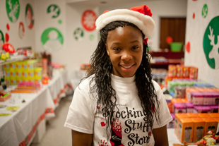 Catrina Warren is Volunteering at the Stocking Stuffer Store to benefit Crittenton Centers.
  She is a senior at Manuel High School and a member of the Tomorrow's Scientists, Technicians & Managers Program.  
Her volunteer work helps her get her required service hours, but she says it’s fun seeing the kids so happy.