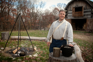 Tom Miller is the facility coordinator at Sommer Park in Peoria.  Today he is demonstrating how to make candles 
during Pioneer Days, which is an educational event showing the daily life of rural Peorians in the mid-19th century.