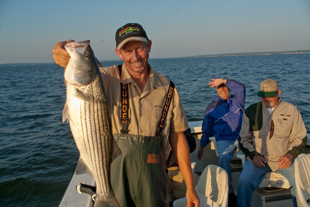 Mickey Rose has run a fishing guide service in Kingston, OK for the last 21 years he is a 4th generation Kingston resident. 
On being a fishing guide Mickey says, 'It is fun being around while people are having fun... and we have lots of fun'.