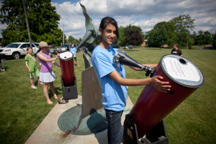 Imaan Malik is a student volunteer at Lake View Museum. Today she is setting up a telescope for the viewing of the transit of Venus.  ‘I like working with kids’ she said about why she volunteers at the museum.