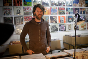 Matt McClellan helps out at his girlfriend’s record store, Ribbon Records in downtown Peoria. He says he enjoys 
exploring vintage and obscure vinyl records. ‘There is a lot of good music just below the surface’ he said.