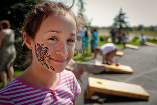 Angela Dugan, age 11, had her face painted at her church picnic.
 She is a 6th grader at Dunlap Middle School, she is learning to play the guitar and she likes flowers.
