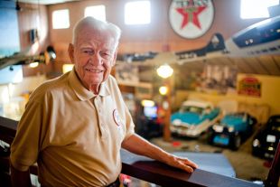 Bryce Brand volunteers at Wheels of Time Museum in Peoria.  The 90 year-old says it gives him something to do. Behind him is a model of a B17 bomber, he told me about how he flew a few of them in 1944 ‘right after getting my wings’.