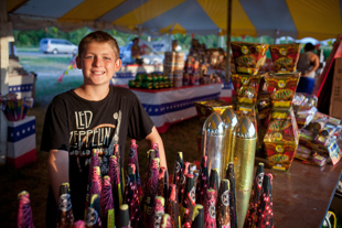 Devlin Cooper, from Doniphan, MO, thinks selling fireworks in Chillicothe, IL is fun. ‘I’m good at hustling’ he said.