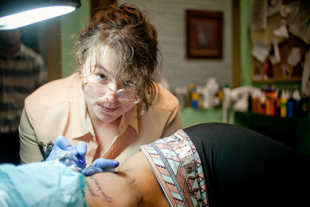 Chris Davis has been around tattoos all her life. She grew up at her Mom’s shop, Dream Illustration Tattoos in Chillicothe.  Now the second generation tattoo artist says, ‘it’s the most fun job I can think of’.