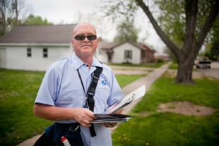 Marvin Irby has only been a postal carrier since October. His change in careers was motivated 
mostly by the economy. He does not mind his more than 10 miles of walking each day 
because, ‘I like the outdoors and meeting and getting to know the people,’ he said.