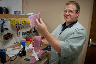 Jason Bruning works on a Hip Knee Ankle Foot Orthosis at Comprehensive Prosthetics and Orthotics.
 He likes the fact that he doesn't have a desk job, he gets to work with his hands
 and he also gets to work with the patients and see the results of his work.